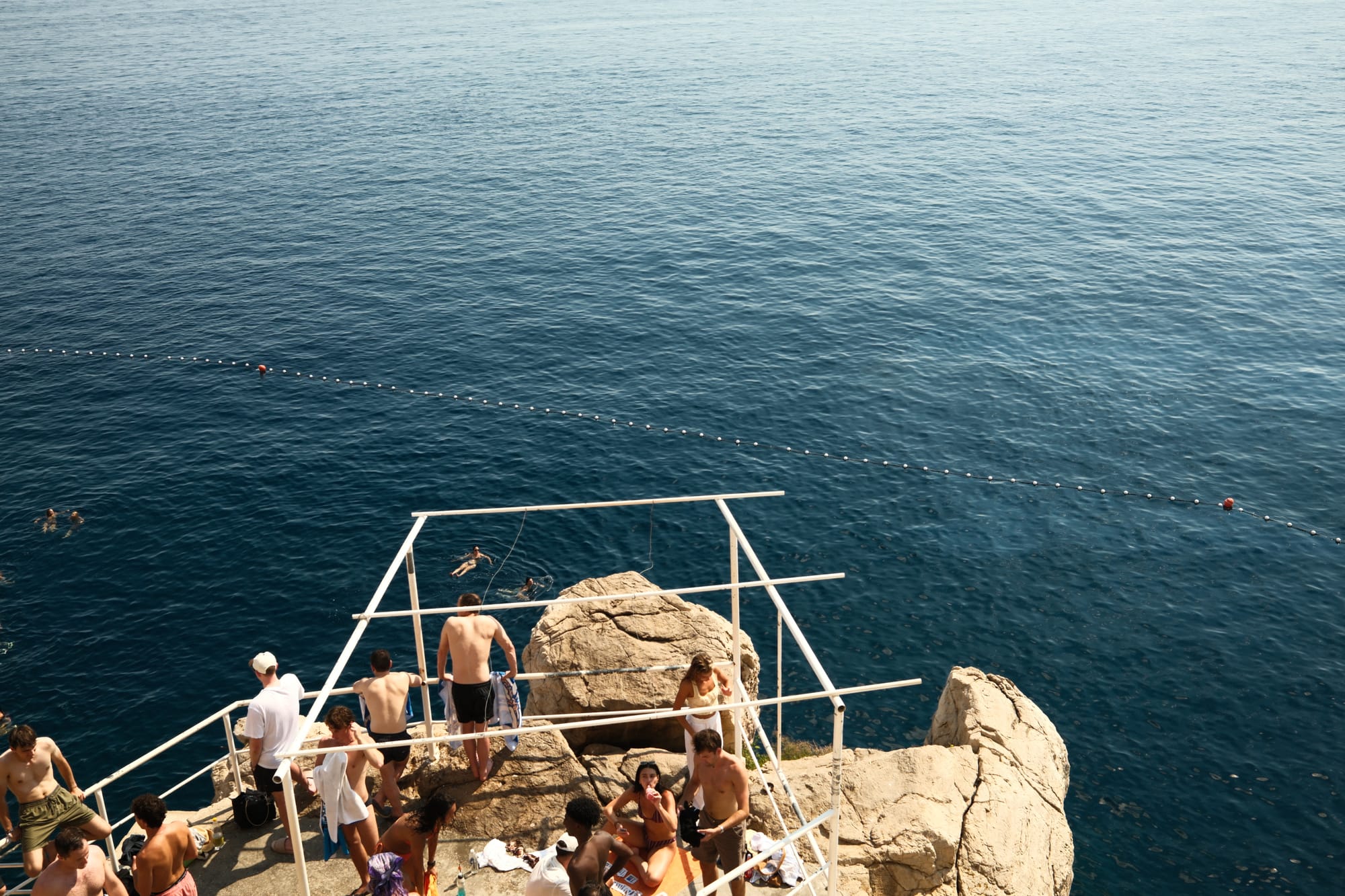 The jumping platform at Buza Bar, looking down at the swimmers below